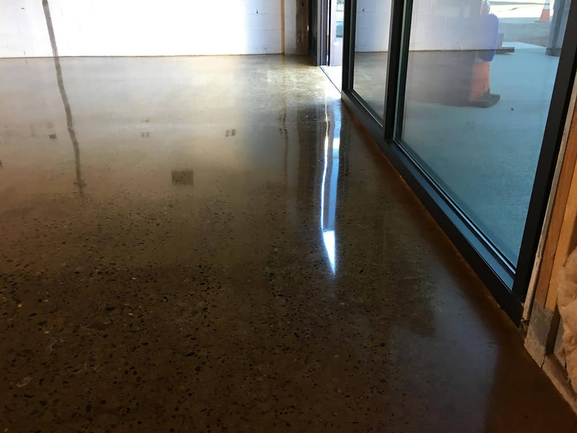 Glossy polished concrete floor in a Solano County commercial building, showcasing professional concrete polishing results