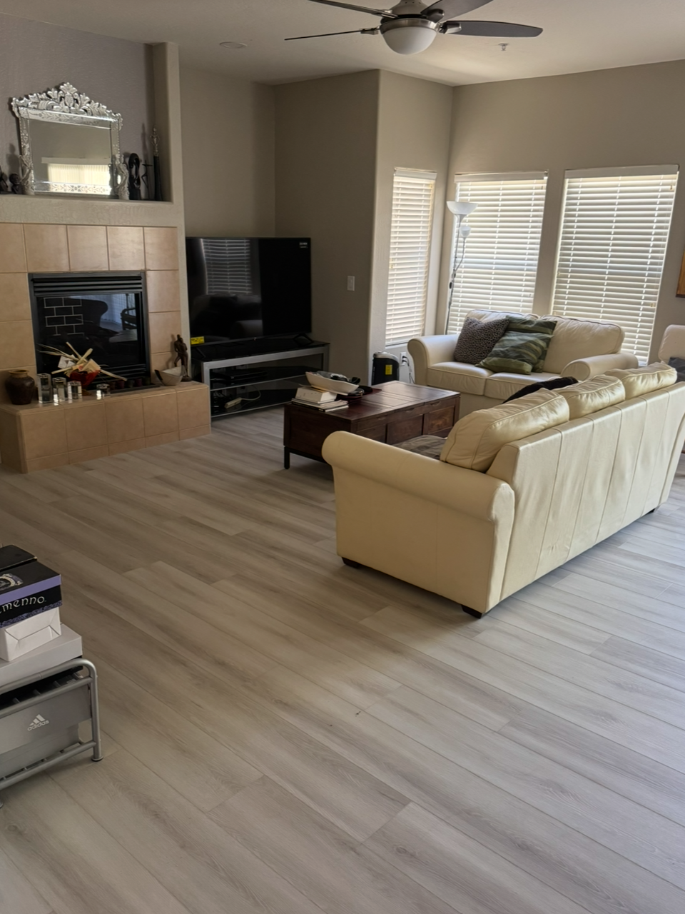 Light gray wood-look decorative concrete overlay flooring in a Petaluma living room by J&C Concrete Restoration