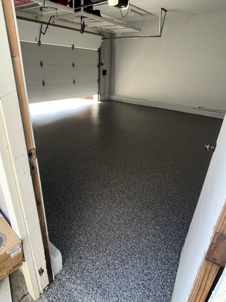 Gray vinyl chip epoxy garage floor coating in a Vacaville two-car garage by J&C Concrete, North Bay CA