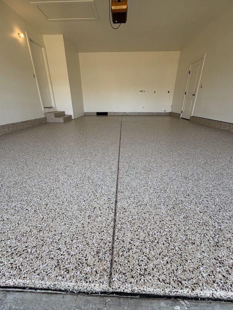 Freshly completed epoxy flake garage floor coating in a residential garage, North Bay California