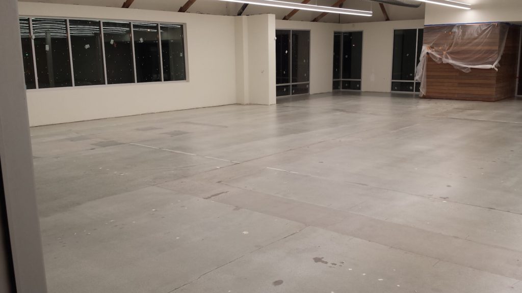 Large empty commercial warehouse space with freshly polished smooth concrete floors in Solano County CA