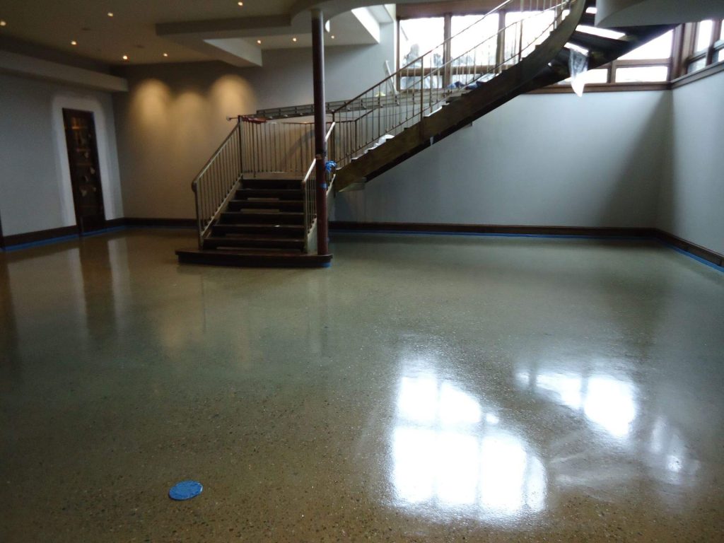 Glossy polished concrete floor in a commercial lobby, ideal for winery retail spaces in California's North Bay