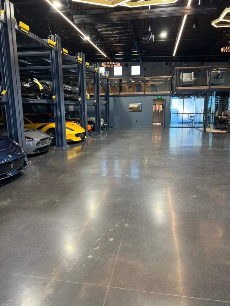 Polished concrete floor in a car showroom by J&C Concrete Restorations